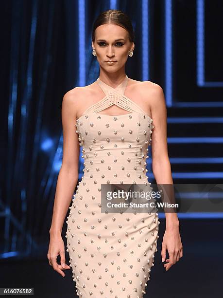 Model walks the runway at the Ezra show during Fashion Forward Spring/Summer 2017 at the Dubai Design District on October 21, 2016 in Dubai, United...