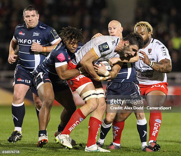 Toulon's Charles Ollivon is tackled by Sale Sharks' Paolo Odogwu during the Rugby Champions Cup Pool 3 match between Sale Sharks and Toulon at the AJ...