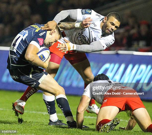 Sale Sharks' Byron McGuigan fends off the tackle of Toulon's Bryan Habana during the Rugby Champions Cup Pool 3 match between Sale Sharks and Toulon...