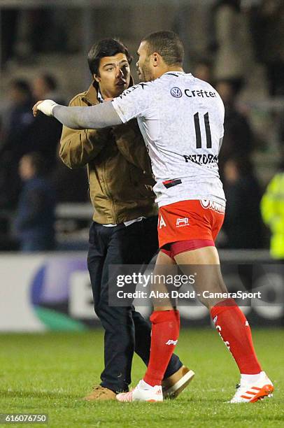 Second pitch invader rushes up to talk to Toulon's Bryan Habana during the Rugby Champions Cup Pool 3 match between Sale Sharks and Toulon at the AJ...