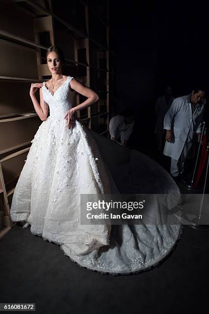 Model backstage ahead of the Ezra show during Fashion Forward Spring/Summer 2017 at the Dubai Design District on October 21, 2016 in Dubai, United...