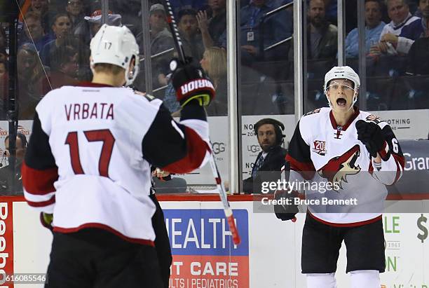 Jakob Chychrun of the Arizona Coyotes celebrates a second period goal by Radim Vrbata against the New York Islanders at the Barclays Center on...