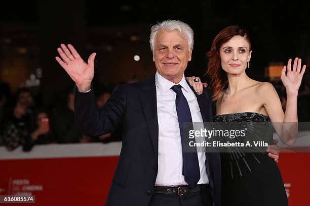 Director Michele Placido and Federica Vincenti walk the red carpet for '7 Minuti' during the 11th Rome Film Festival at Auditorium Parco Della Musica...