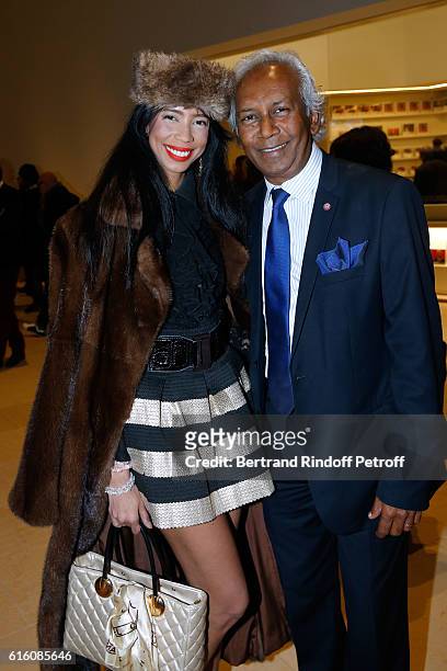Ambassador Rani Vanouska T. Modely aka Vanessa Modely and her father Jean-Albert Modili Tamboura attend the "Icones de l'Art Moderne, La Collection...