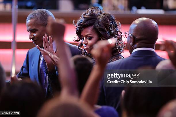President Barack Obama and first lady Michelle Obama attend the BET's 'Love and Happiness: A Musical Experience" in a tent on the South Lawn of the...