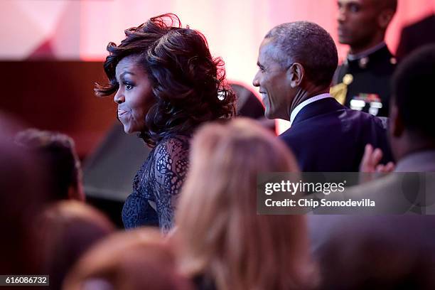 President Barack Obama and first lady Michelle Obama attend the BET's 'Love and Happiness: A Musical Experience" in a tent on the South Lawn of the...