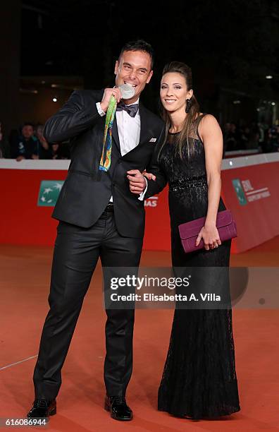 Paolo Pizzo and wife Lavinia Bonessio walk a red carpet for '7 Minuti' during the 11th Rome Film Festival at Auditorium Parco Della Musica on October...