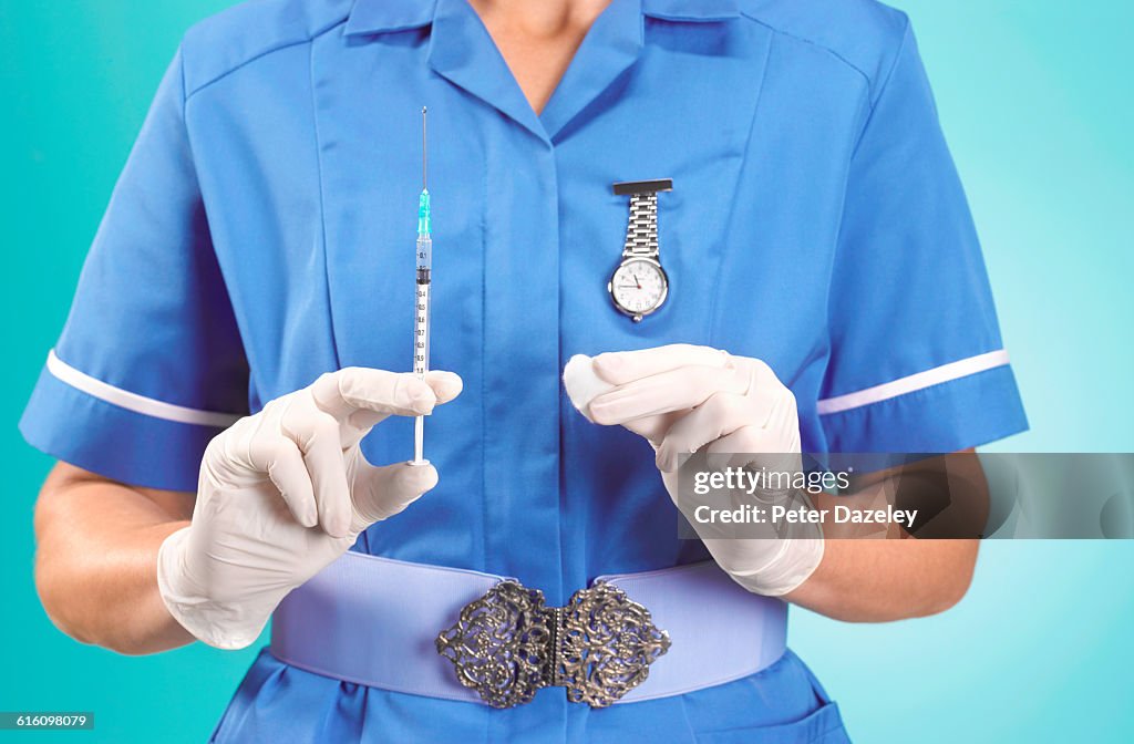 Nurse giving tetanus/travel vaccination