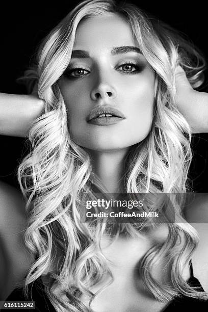 photo of young beautiful woman - long blonde curly hair stock pictures, royalty-free photos & images