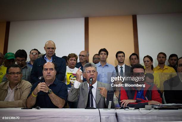 Henry Ramos Allup, speaker of Venezuela's National Assembly, center, speaks as Henrique Capriles, opposition leader and governor of the State of...