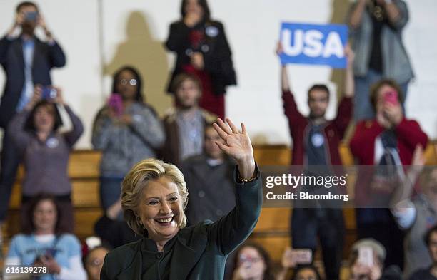 Hillary Clinton, 2016 Democratic presidential nominee, waves during a campaign event in Cleveland, Ohio, U.S., on Friday, Oct. 21, 2016. Just 24...