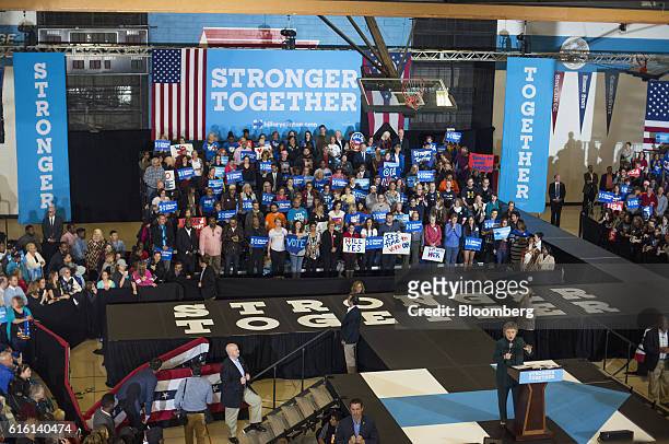 Hillary Clinton, 2016 Democratic presidential nominee, bottom right, speaks during a campaign event in Cleveland, Ohio, U.S., on Friday, Oct. 21,...