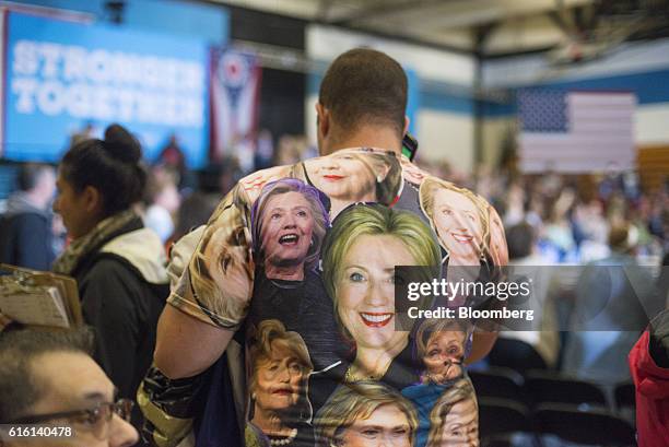 An attendee wears a t-shirt featuring faces of Hillary Clinton, 2016 Democratic presidential nominee, during a campaign event in Cleveland, Ohio,...