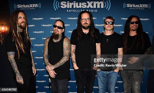 Brian "Head" Welch, Reginald "Fieldy" Arvizu, Jonathan Davis, Ray Luzier and James "Munky" Shaffer of Korn pose backstage at a private concert for...