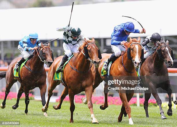 Jockey Jamie McDonald riding Archives beats Vlad Duric riding Crafted to win race 4 the Telstra Phoneworlds Stakes during Cox Plate Day at Moonee...