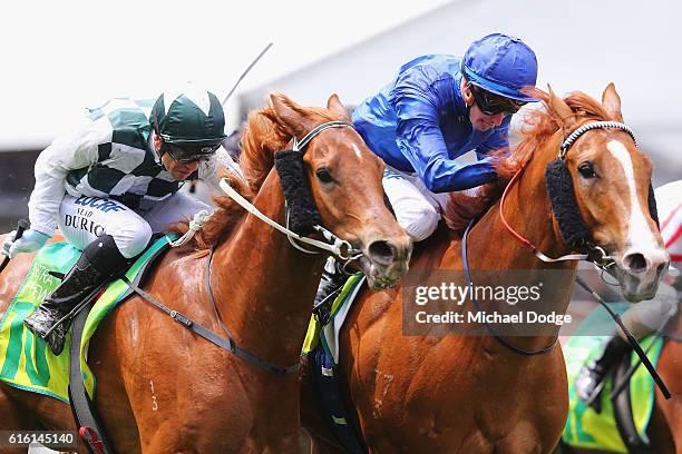 Jockey Jamie McDonald riding Archives beats Vlad Duric riding Crafted to win race 4 the Telstra Phoneworlds Stakes during Cox Plate Day at Moonee...
