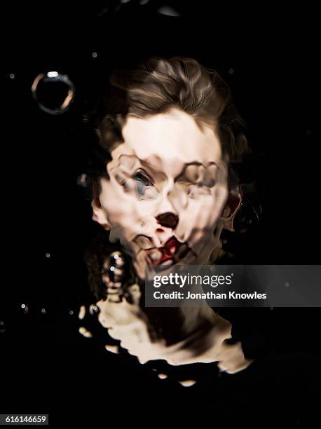 distorted water portrait of a female - imagen distorsionada fotografías e imágenes de stock
