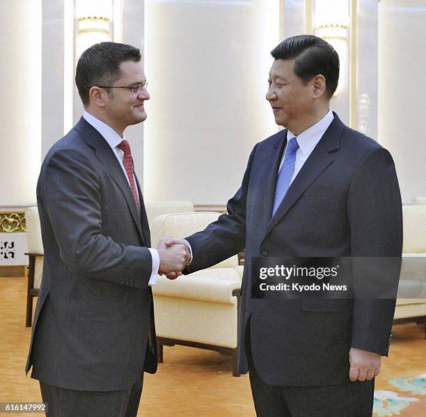 China - Vuk Jeremic , president of the U.N. General Assembly, shakes hands with Chinese Communist Party leader Xi Jinping at the Great Hall of the...