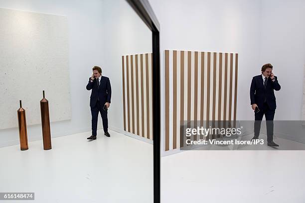Visitor looks art of work during the opening of the 43rd edition of Fiac, the International Contemporary Art Fair at the the Grand Palais on October...