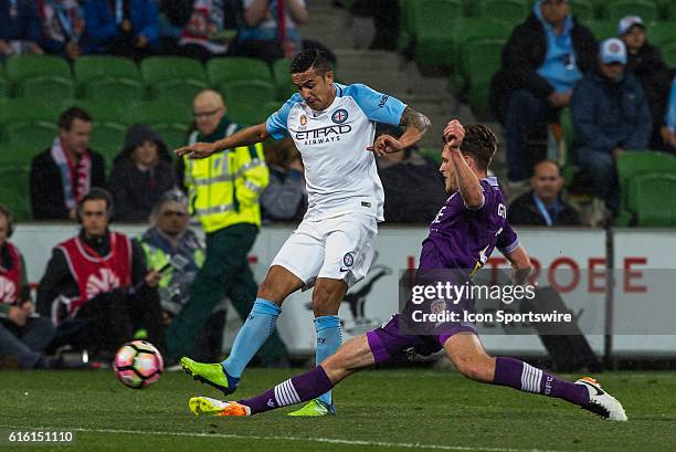 Tim Cahill of Melbourne City and Rostyn Griffiths of Perth Glory contes the ball during the 3rd Round of the 2016-17 A-League Season between...