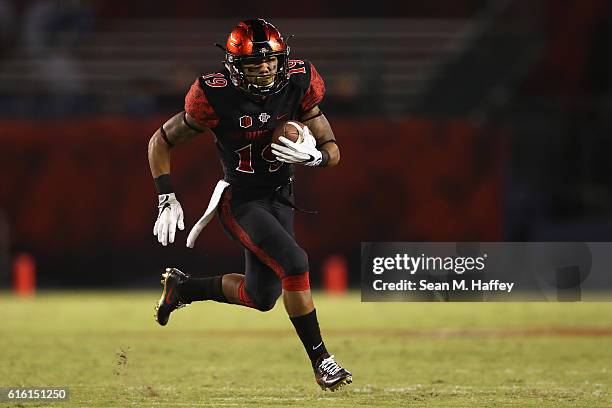 Donnel Pumphrey of the San Diego State Aztecs runs upfield for a touchdownduring the first half of a game against the San Jose State Spartans at...