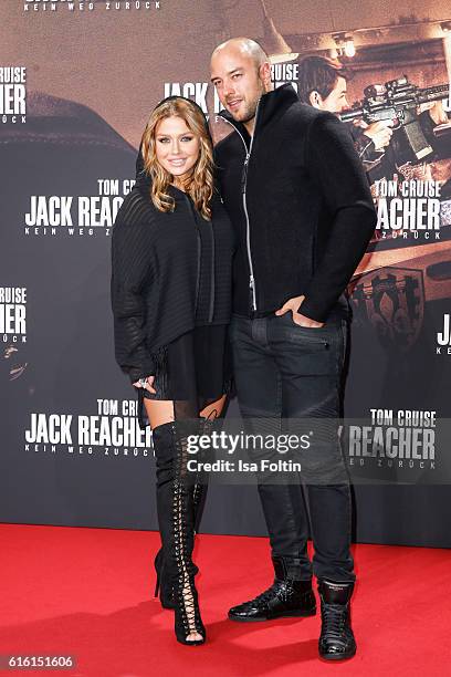 German singer Kim Gloss and her boyfriend Alexander Beliaikin attend the 'Jack Reacher: Never Go Back' Berlin Premiere at CineStar Sony Center...