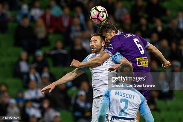 Dino Djulbic of Perth Glory and Josh Rose of Melbourne City head the ball and each others heads during the 3rd Round of the 2016-17 A-League Season...