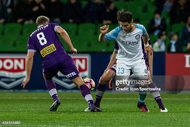 Bruno Fornaroli of Melbourne City controls the ball in front of Rostyn Griffiths of Perth Glory and Alex Grant of Perth Glory during the 3rd Round of...