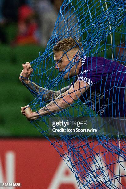 Andy Keogh of Perth Glory leans out in the net of the goal after a failed attempt at goal during the 3rd Round of the 2016-17 A-League Season between...