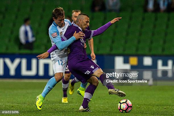 Nebojsa Marinkovic of Perth Glory and Nick Fitzgerald of Melbourne City contest the ball during the 3rd Round of the 2016-17 A-League Season between...