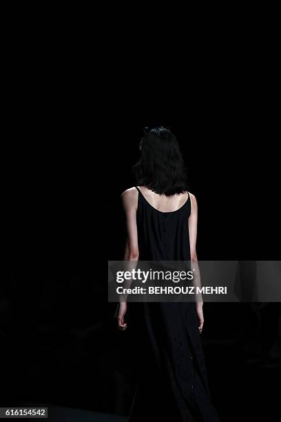 In this picture taken on October 17 Japanese model Rina Fukushi presents a creation by Japanese designer Tae Ashida during the Tae Ashida 2017...