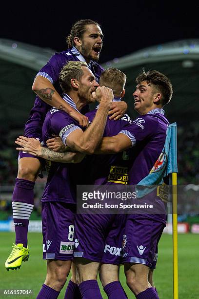 Andy Keogh of Perth Glory, Rostyn Griffiths of Perth Glory and other Perth Glory players celebrate their second goal during the 3rd Round of the...