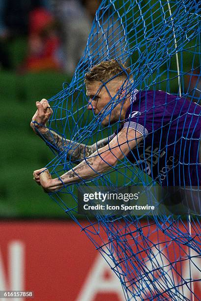 Andy Keogh of Perth Glory leans out in the net of the goal after a failed attempt at goal during the 3rd Round of the 2016-17 A-League Season between...