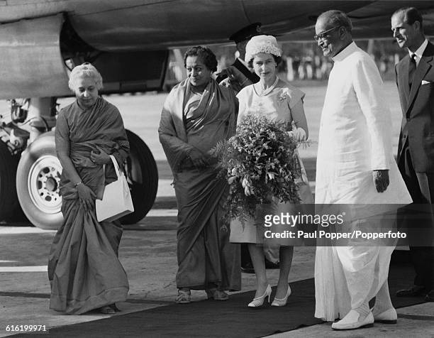 Queen Elizabeth II and Prince Philip, Duke of Edinburgh are welcomed by, from left, Vijaya Lakshmi Pandit , Governor of West Bengal Padmaja Naidu and...