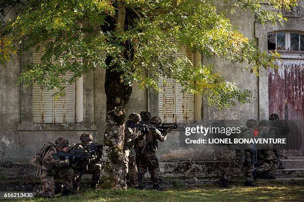 Soldiers of the French Foreign Legion's 13th Demi-Brigade take part in an exercice during a press visit to its future military camp "Camp du Larzac"...