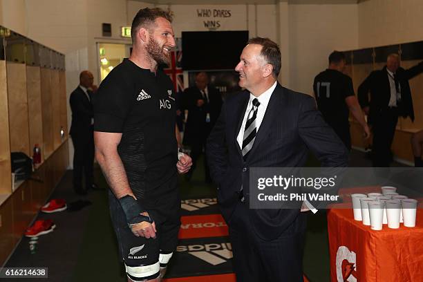 Prime Minister John Key congratulates All Black captain Kieran Read inside the dressing room during the Bledisloe Cup Rugby Championship match...