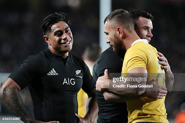 Malakai Fekitoa of the All Blacks with Ryan Crotty Quade Cooper mof the Wallabies after the match Bledisloe Cup Rugby Championship match between the...