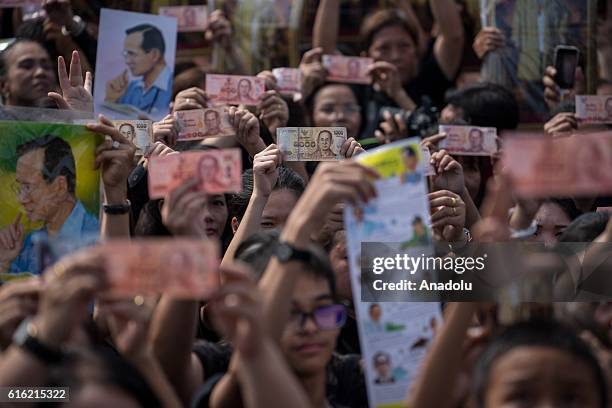 Mourners dressed in black gather around the Grand Palace as they wait to perform the Royal Anthem at Sanam Luang in Bangkok, Thailand on October 22,...