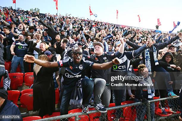 Melbourne Victory fans celebrate a goal by Besart Berisha of the Victory during the round three A-League match between Adelaide United and Melbourne...