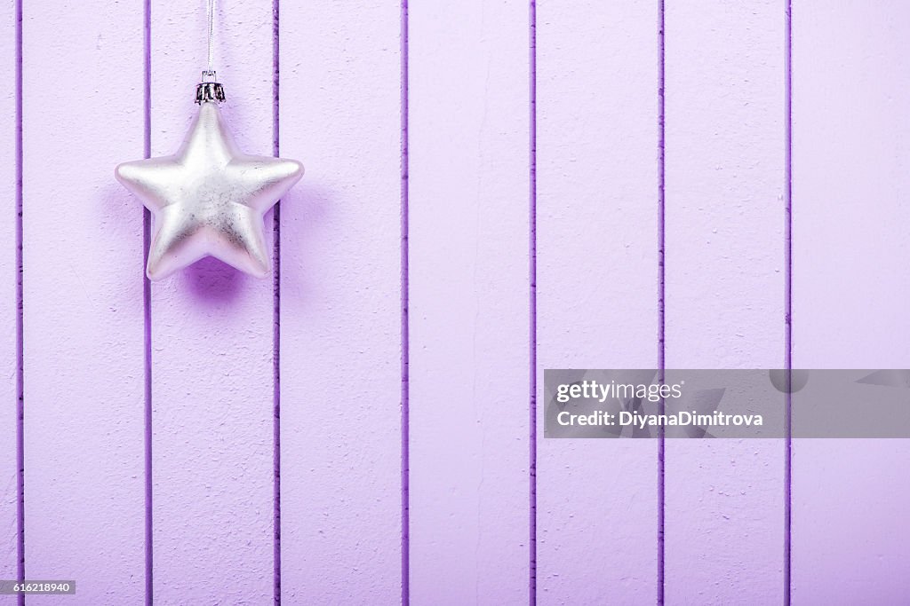 Christmas decoration on a purple striped background - selective