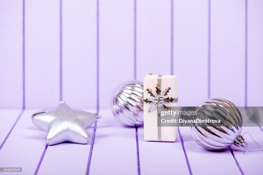 Christmas decoration on a purple striped background - selective