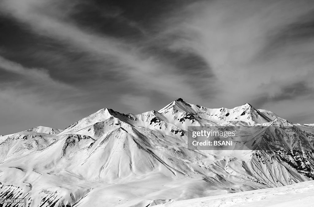 Winter snow mountains in windy day