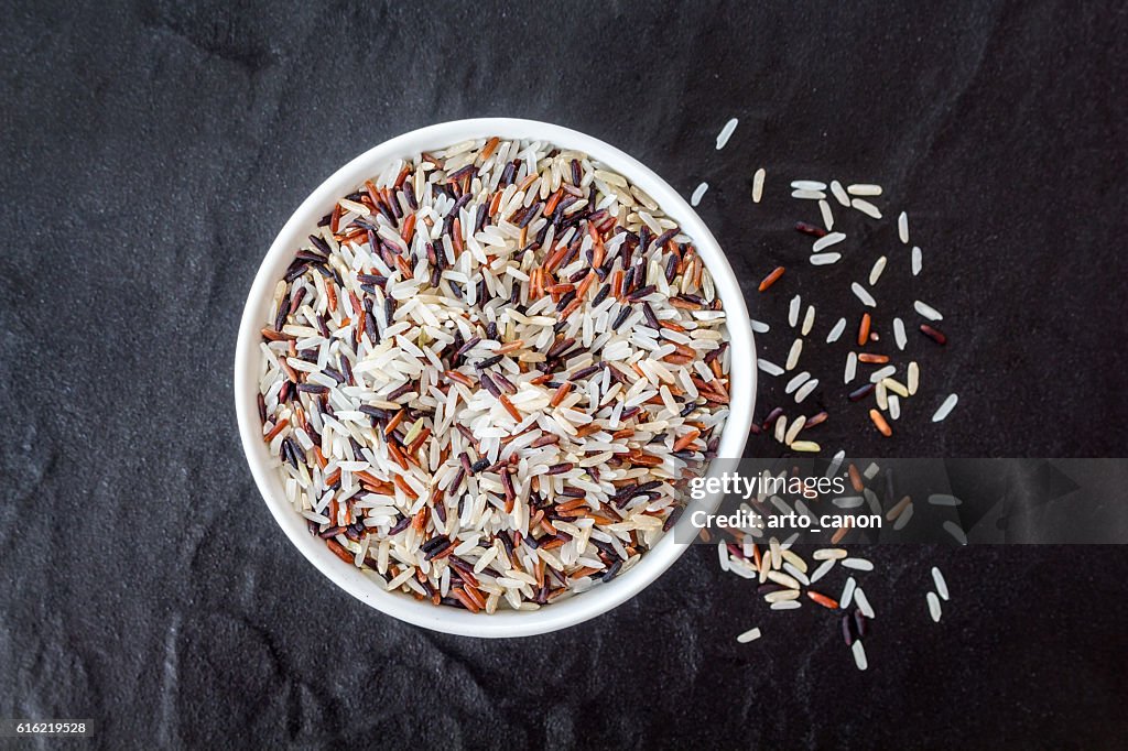 Rice in a bowl on black background