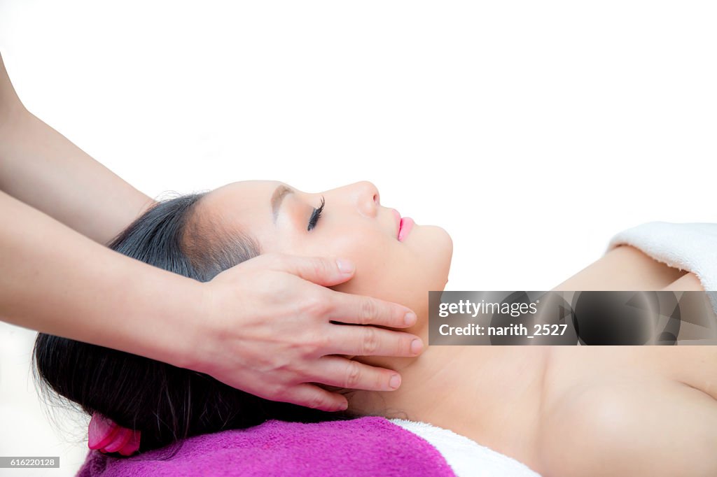 Beautiful woman is getting a facial massage