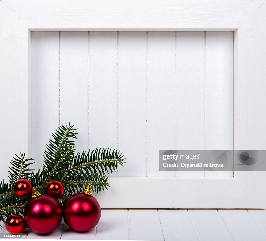 White wooden frame and  christmas decoration over white background