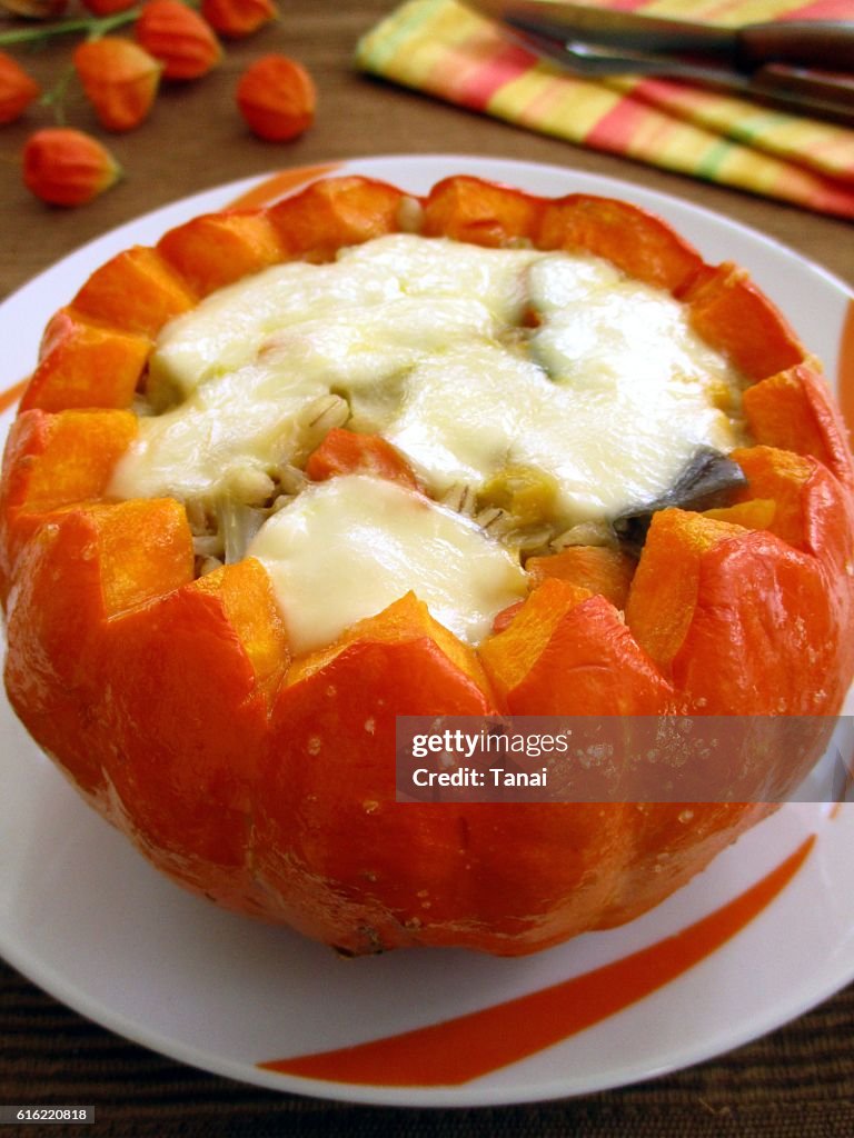 Baked pumpkin stuffed with vegetables and mozzarella