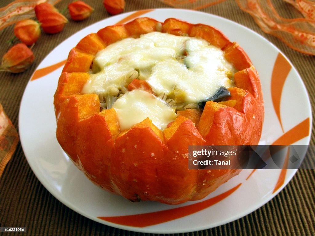 Baked pumpkin stuffed with vegetables and mozzarella