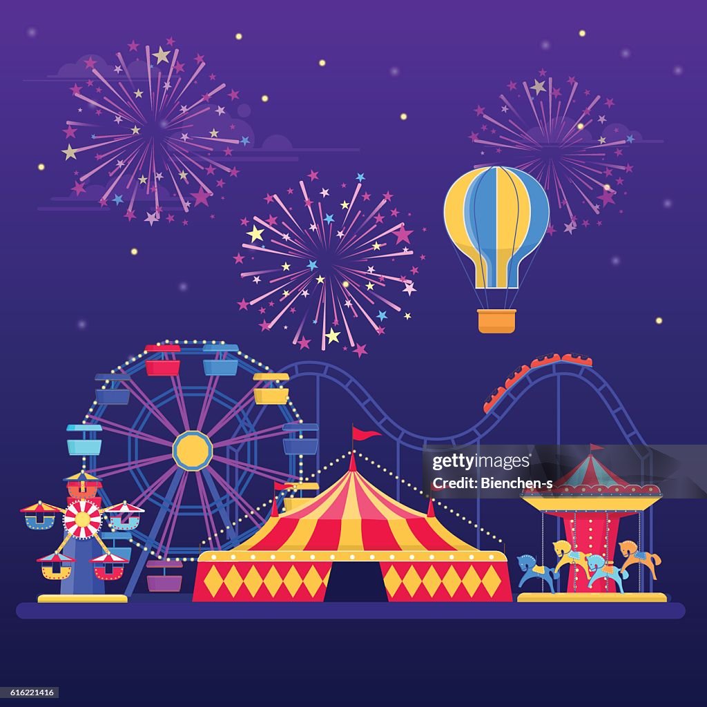 Amusement park at night with fireworks, balloon and rides