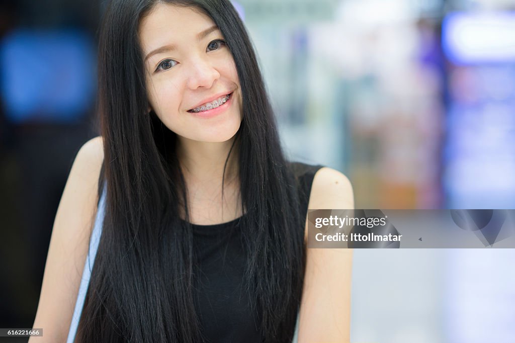 Portrait of asian woman smiling to the camera