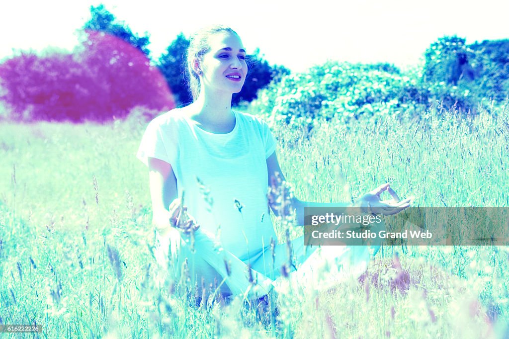 Happy young yoga woman for energy and soul exercises outside